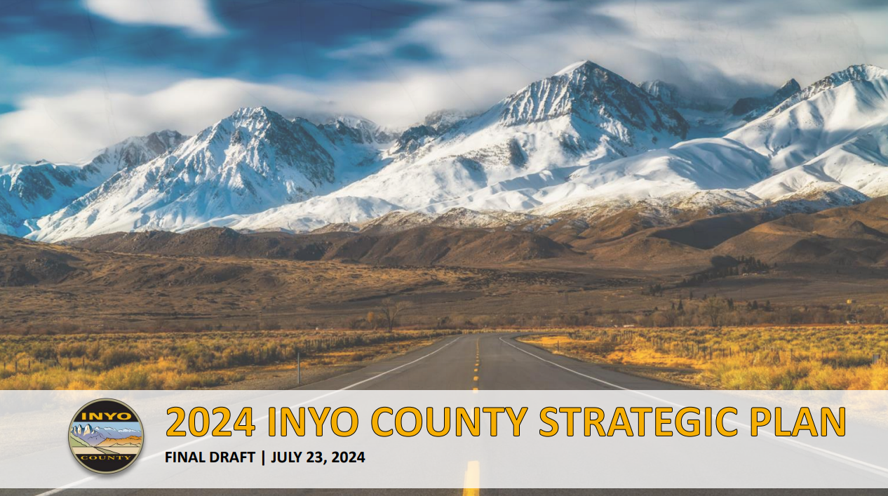Cover page for Inyo County Strategic Plan showing text on photo of highway leading to snowcapped mountains